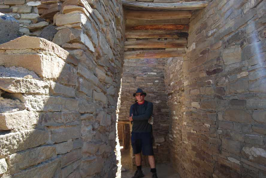 Photographer providing scale at Pueblo Bonito